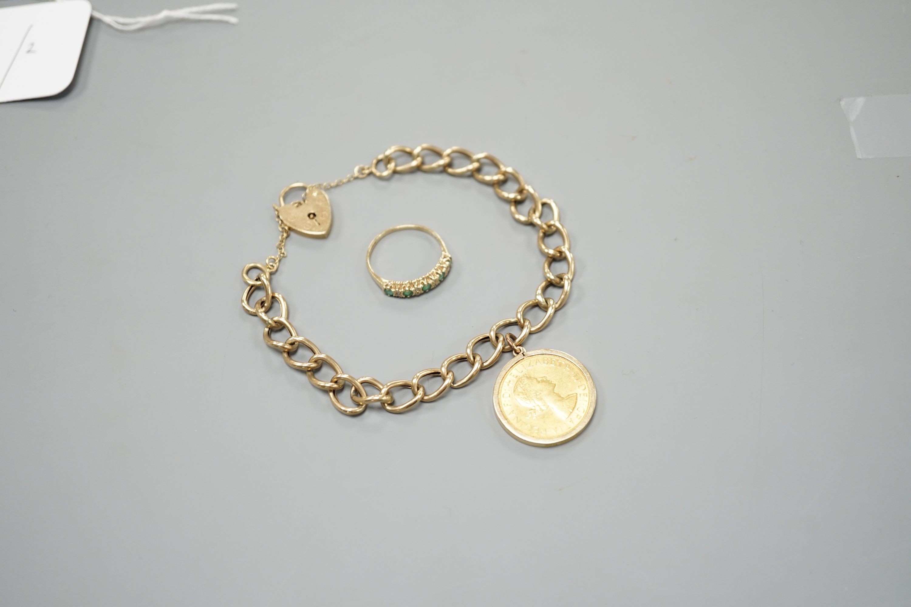A 1962 gold sovereign, on 9ct bracelet with a 9ct gold gem set ring, gross weight 17.7 grams.